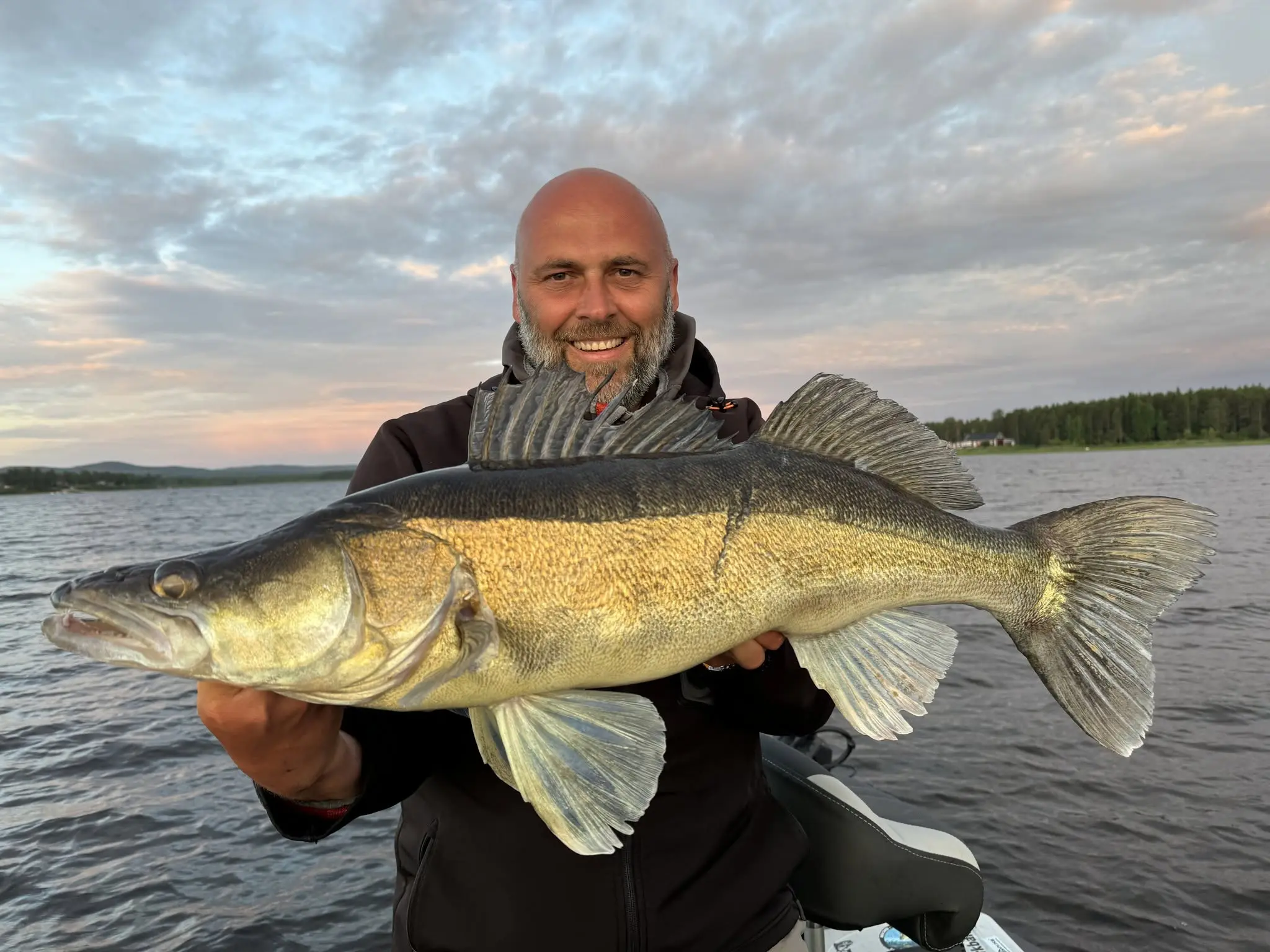 Dano with a large zander by the lake