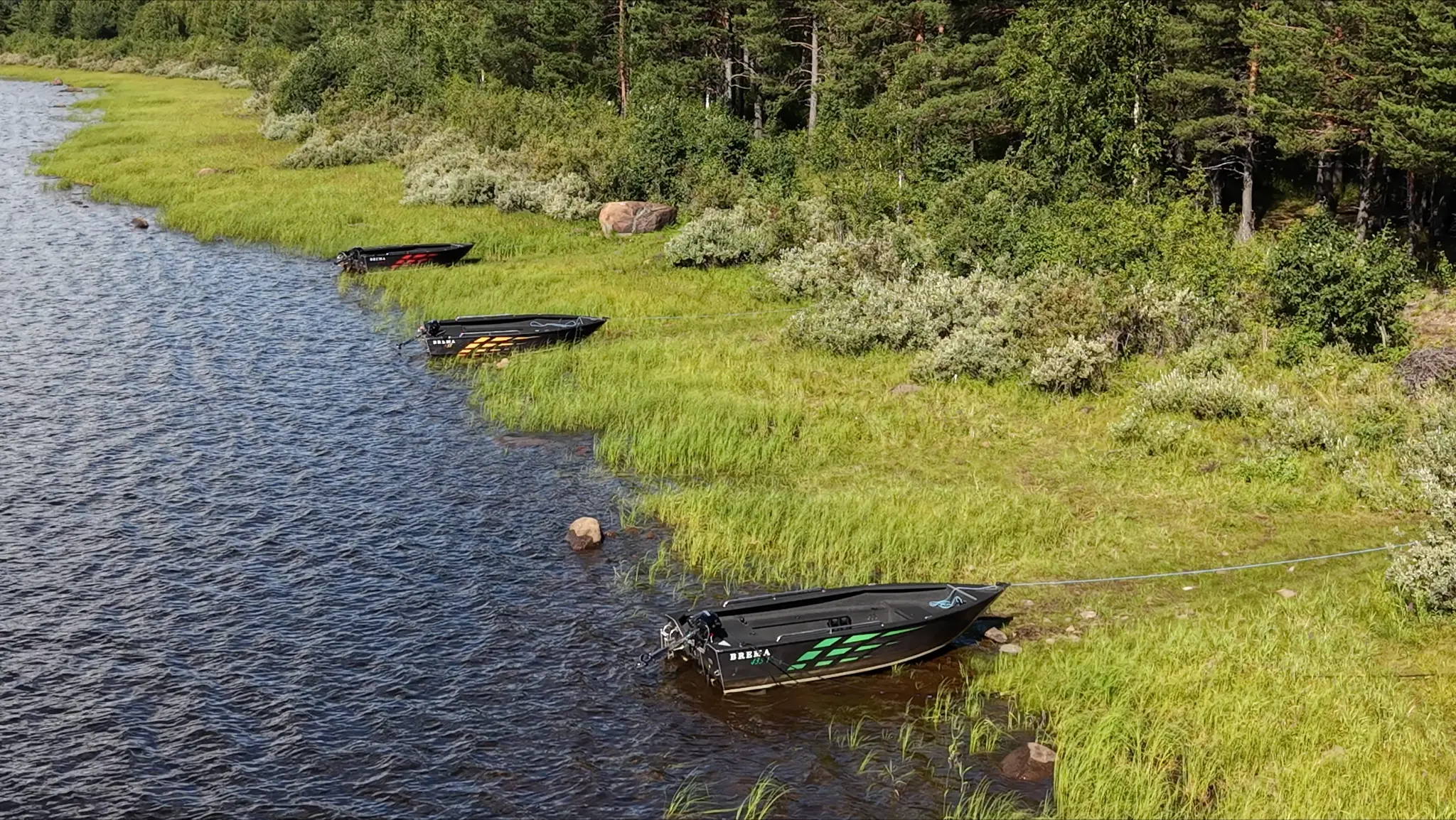 Three Brema 435 boats by the shore