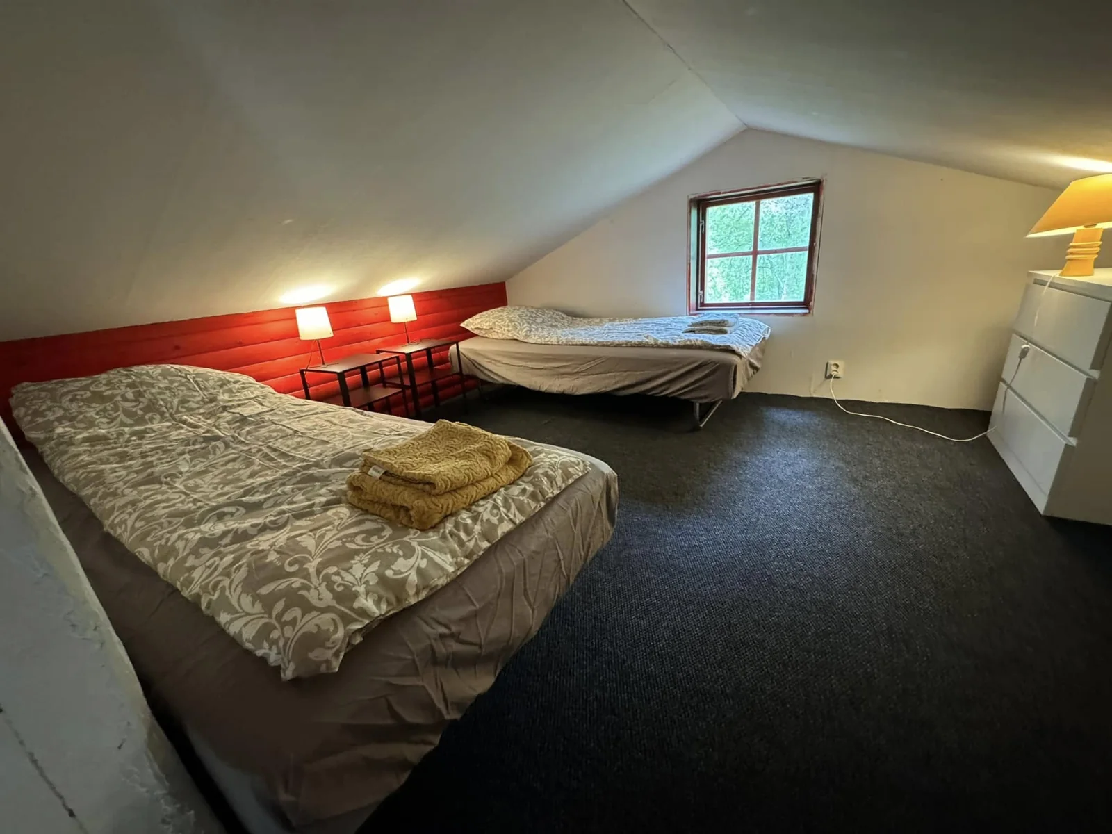 Two single beds on the mezzanine of the large cabin