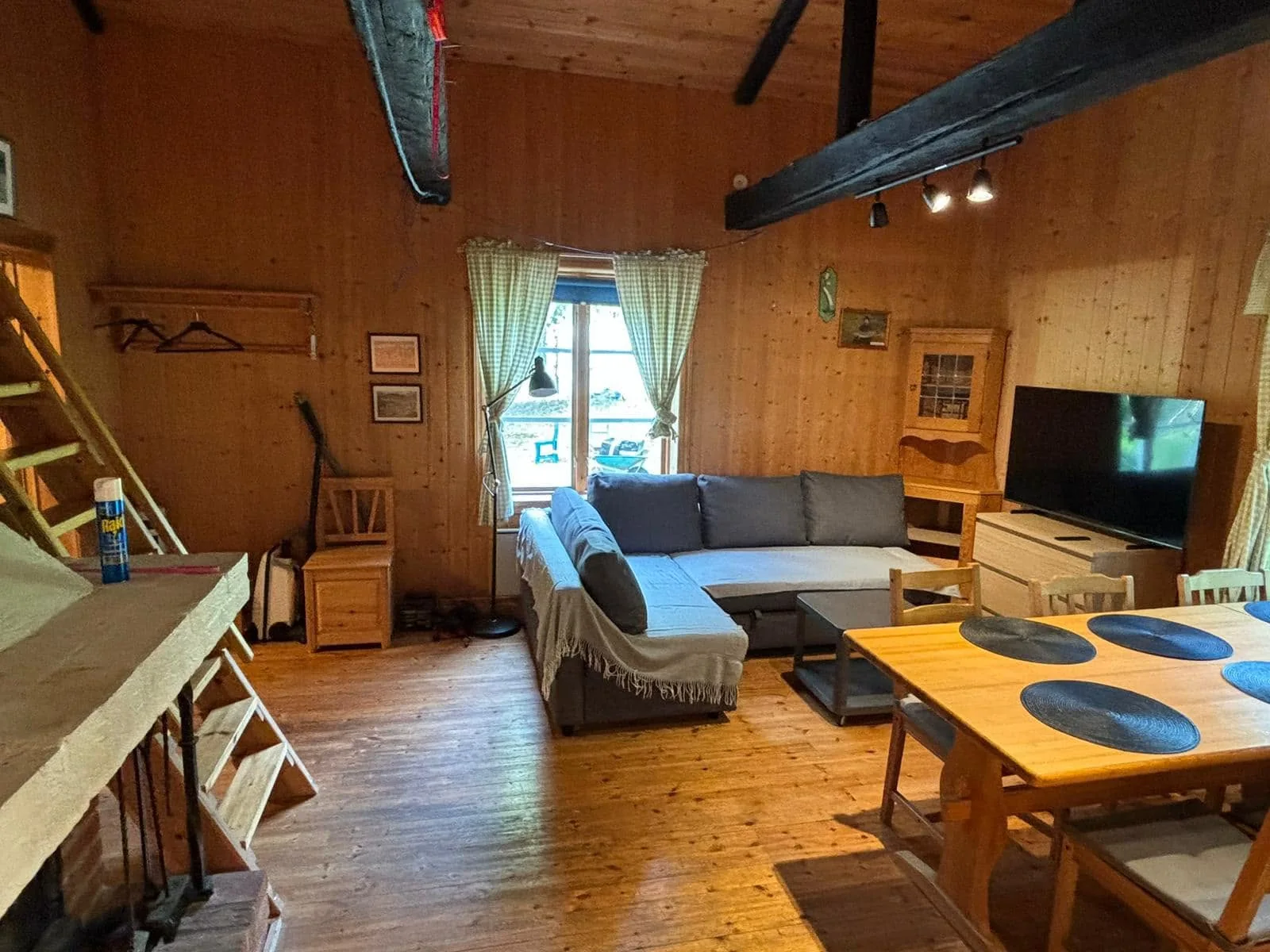 Large cabin living area and kitchen, looking towards the window
