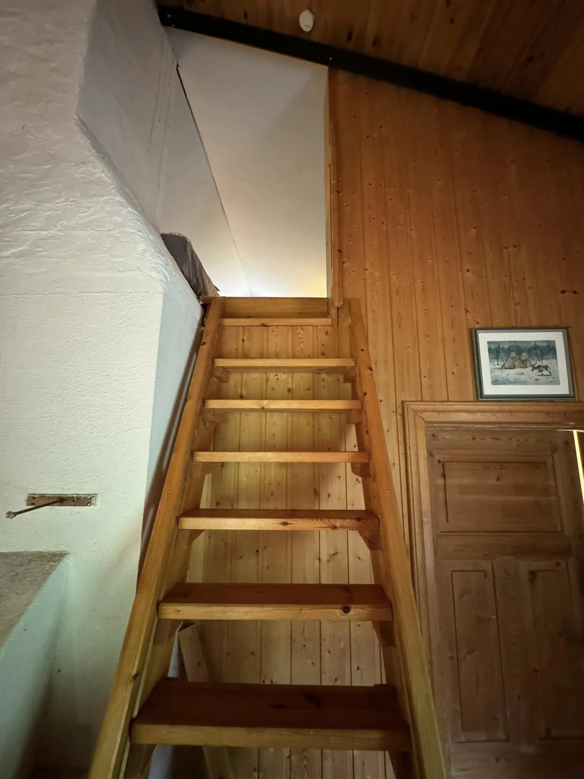 Wooden stairs to the large cabin mezzanine