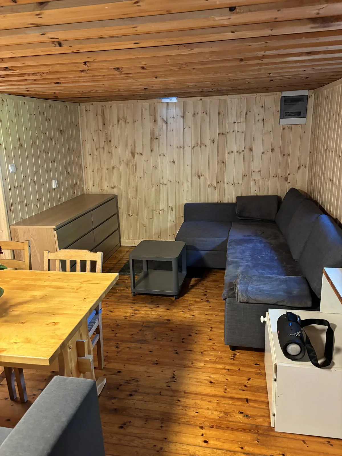 Small cabin room with a corner sofa bed